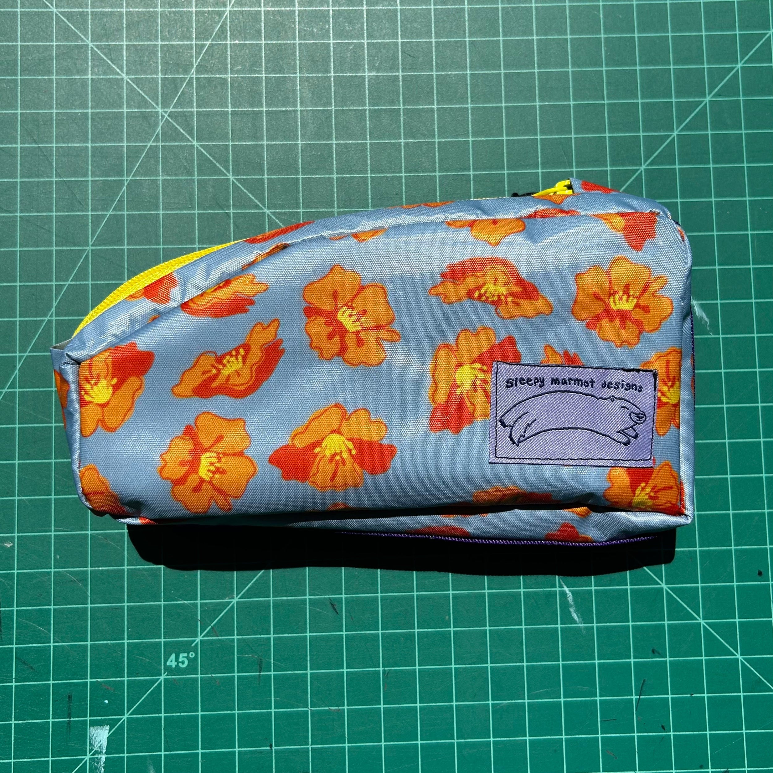 Top tube bag - Orange Flowers w/ yellow zipper and purple webbing